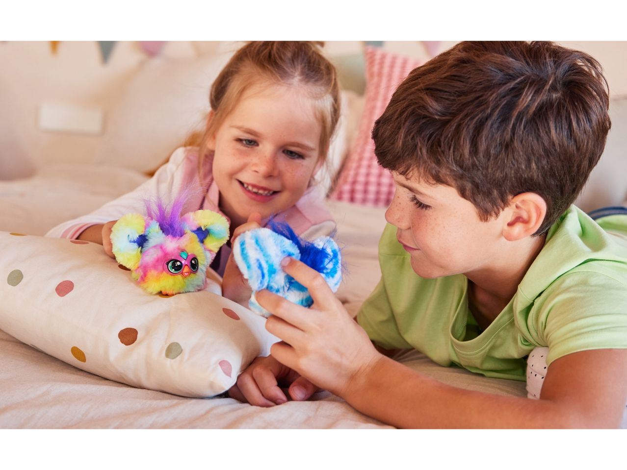 A girl and a boy playing with plush toys