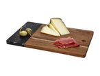 Cheese, cured meat, and caper berries on a two-tone wooden and marble serving board.