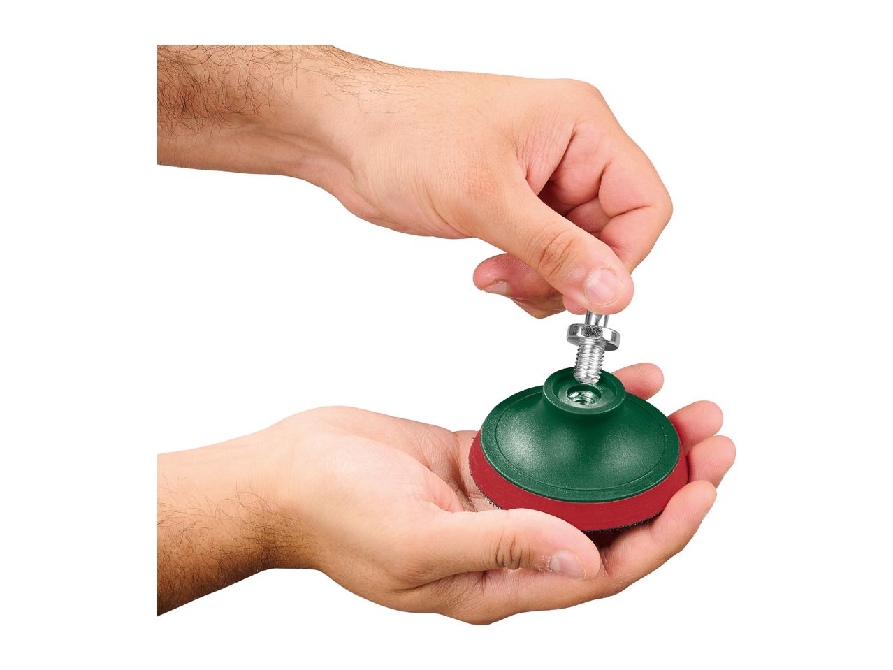 Hands assembling a green and red sanding pad with a metal screw.