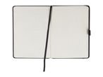 An open grid notebook with a black cover and ribbon bookmark.