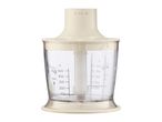 A transparent food chopper attachment with measurement markings and a cream-colored lid.