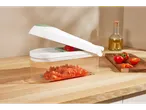 Vegetable chopper with diced tomatoes.