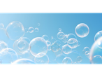 De nombreuses bulles de savon claires flottent sur un ciel bleu vif, évoquant la propreté.