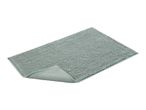 Light green rectangular bath mat with a textured surface