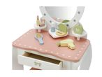 Pink and white wooden toy dressing table with mirror, makeup, brush, and hairdryer.