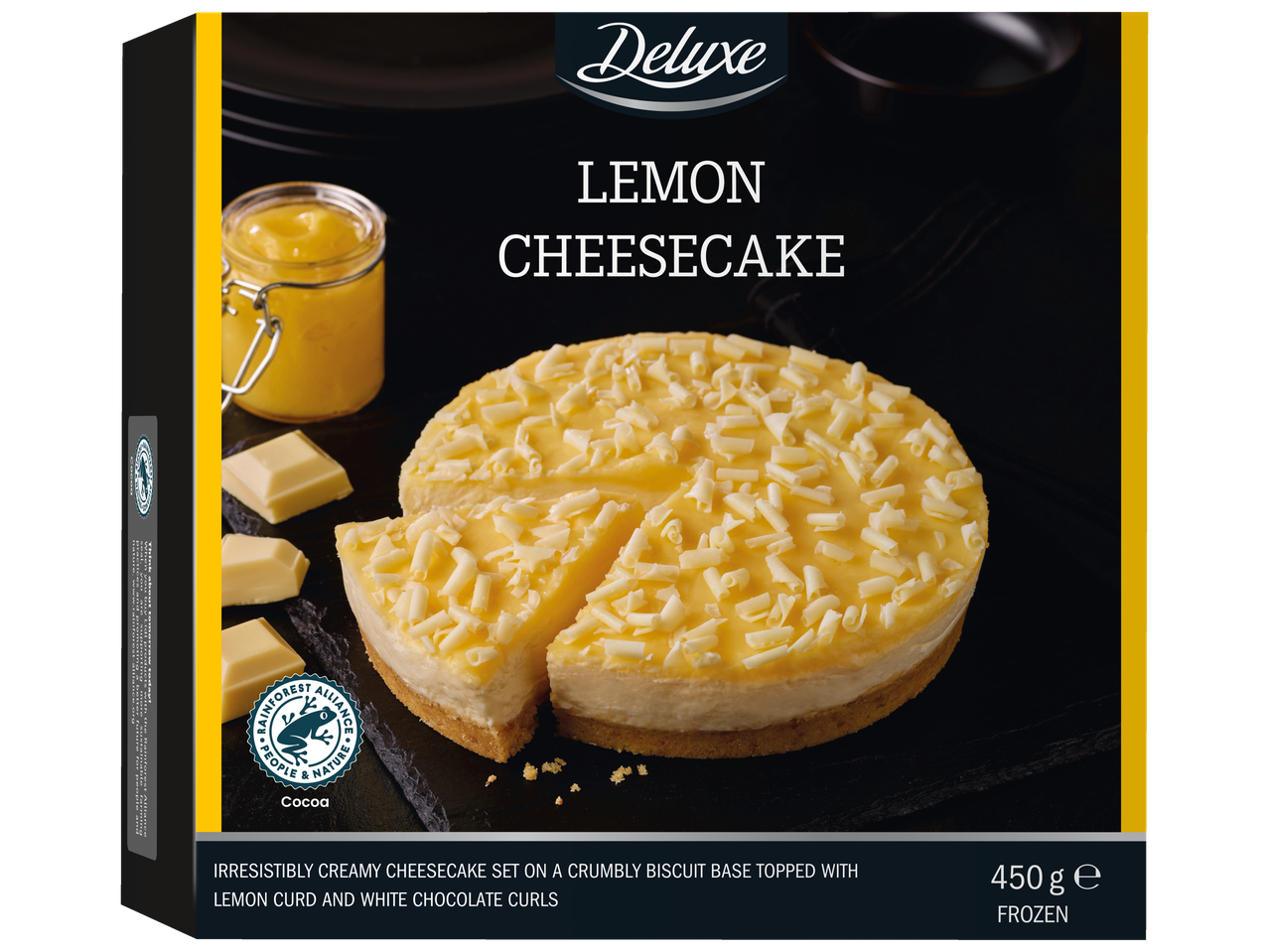 Deluxe Lemon Cheesecake with white chocolate curls, lemon curd, and a Rainforest Alliance seal.