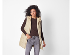 Esmara® Ladies' Gilet in beige worn by a woman with dark brown long-sleeved top and jeans.