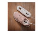 SilverCrest shoe dryer with a pink sneaker on a wooden floor