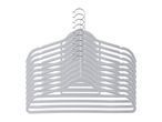 A stack of light grey velvet hangers with chrome hooks, fanned out against a white background.