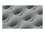 Close-up of a grey inflatable air mattress with a textured, dimpled surface.