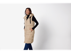 Esmara® Ladies' Longline Padded Gilet in beige, worn by a woman with a black turtleneck and jeans.