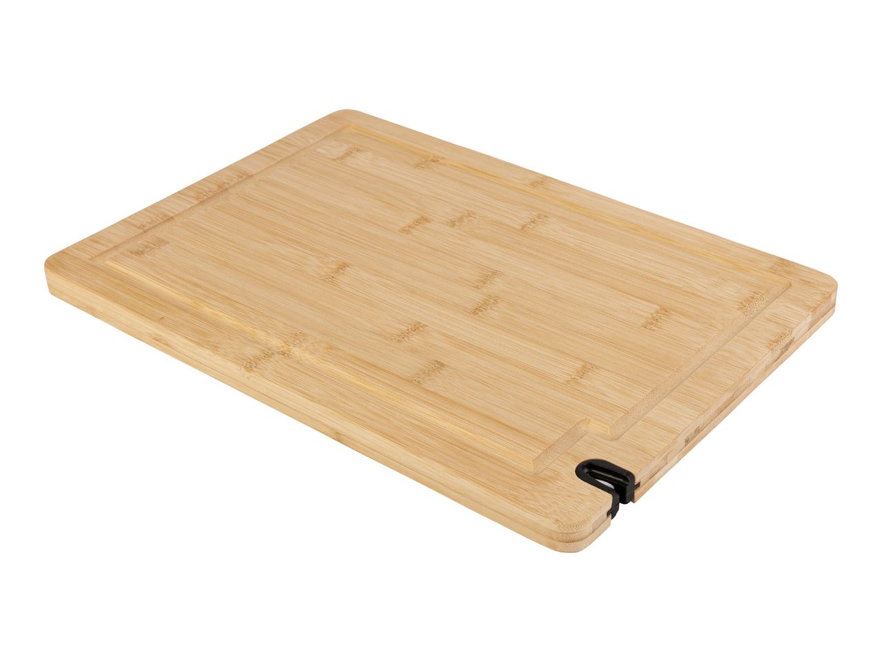 A rectangular bamboo cutting board with a juice groove.