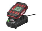 A red and black power tool battery charging on a black charger, with visible product details.