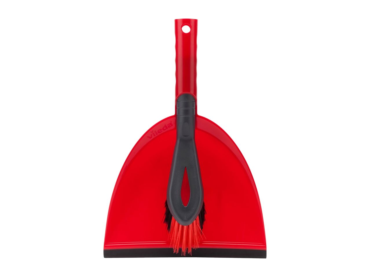 Red dustpan and brush set with black bristles, standing upright.