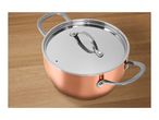 A copper-colored cooking pot with a stainless steel lid on a wooden surface.