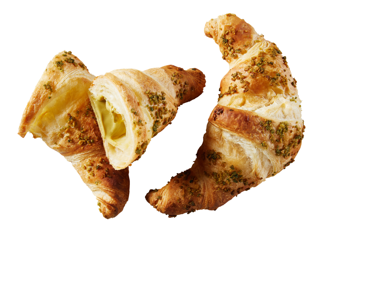 Pistacijų kruasanai, vienas perpjautas su žaliu įdaru