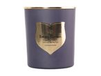 Scented candle in a purple jar with a gold label reading Estate Garden