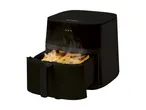 Black air fryer with a basket of golden french fries, emitting steam.