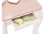 Toy vanity table with hairdryer, brush, and makeup in the drawer