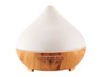 A white ceramic and wood essential oil diffuser.