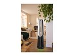 Bladeless tower fan and heater in a modern living room setting.