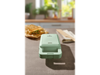 Un aparat de sandwich verde SilverCrest pe un blat de bucătărie.