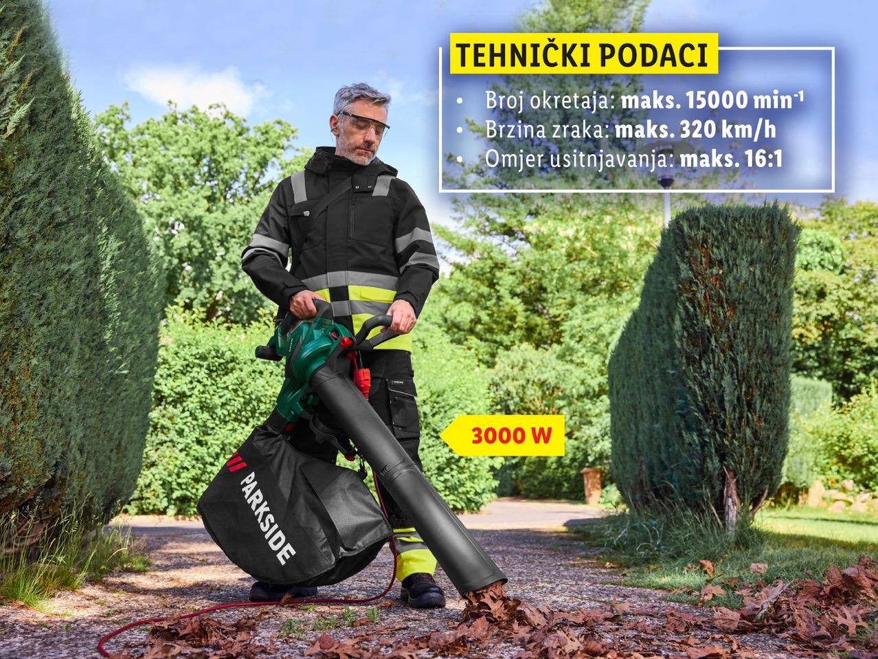 Muškarac koristi Parkside puhač lišća od 3000 W za čišćenje lišća u vrtu.