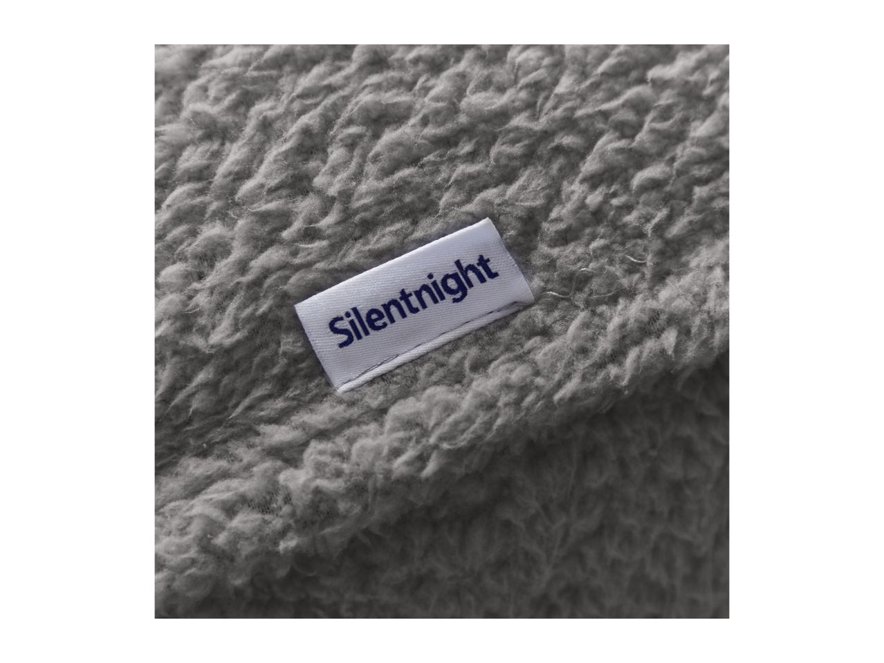 A close-up of a gray fleece blanket with a white label reading 'Silentnight' in blue text.