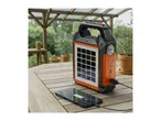 Solar power bank charging a smartphone on a wooden outdoor table.