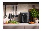 SILVERCREST air fryer and food chopper on a kitchen counter with fresh ingredients.