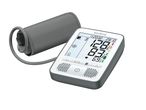 Sanitas blood pressure monitor with cuff displaying readings and time.