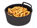 Crispy crinkle-cut fries in a black silicone air fryer basket.