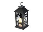 Black Halloween lantern with crow and tree silhouette design and a flickering candle inside
