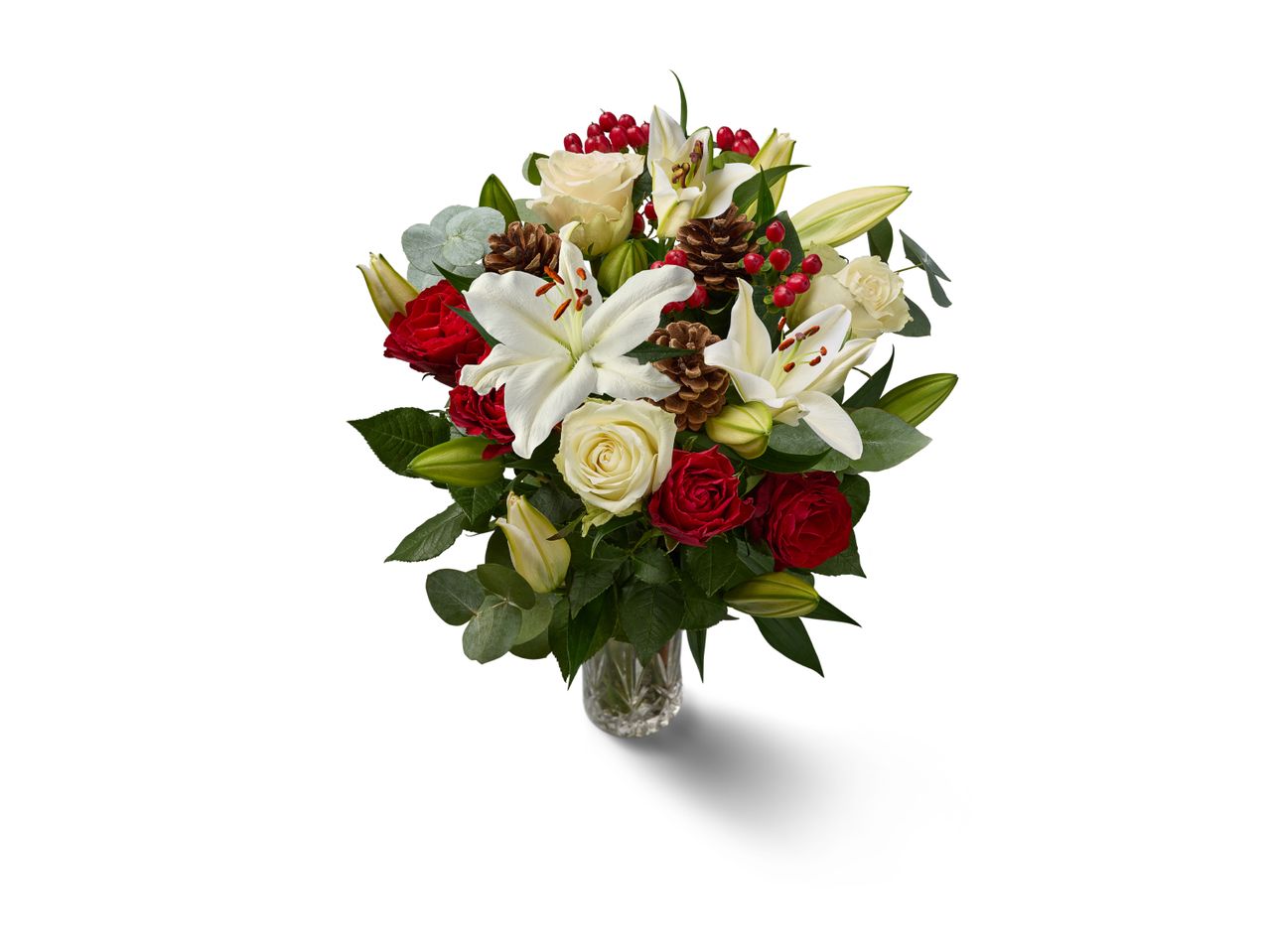 Christmas bouquet with white lilies, red and white roses, pinecones, and red berries