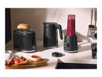 Black toaster, kettle, and blender with a honeycomb pattern on a kitchen counter.