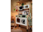 Playtive Wooden Play Kitchen with Christmas decorations and accessories.