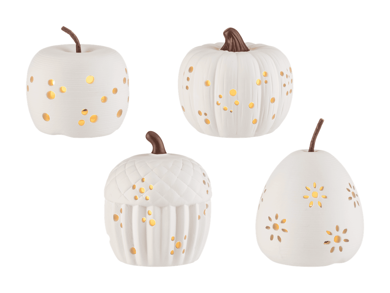 Quatre bougies blanches en forme de fruits et légumes avec des trous lumineux.