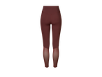 Tumepunased legginsid läbipaistvate detailidega sääreosadel.