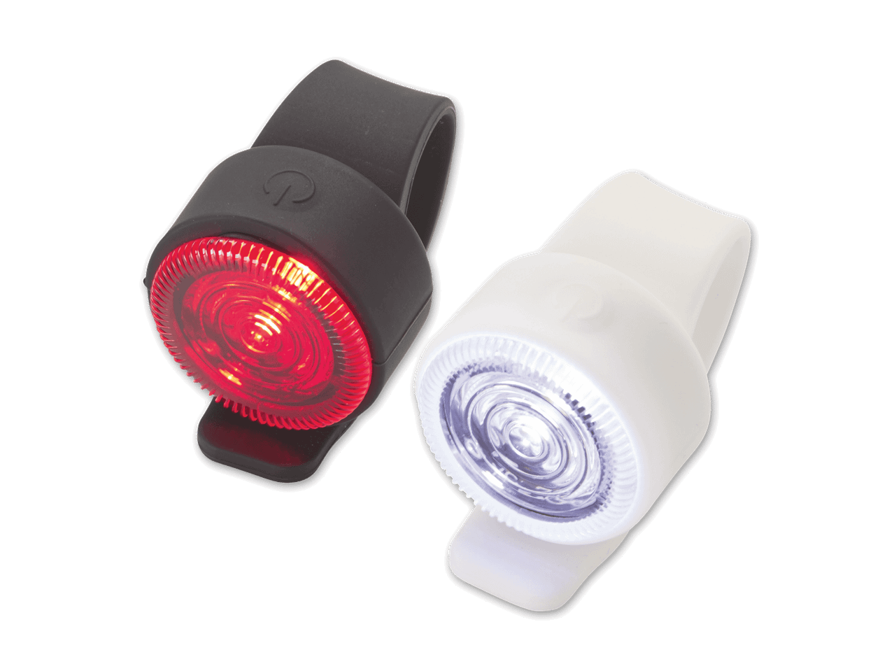 Zwei Fahrradlichter, eines rot und eines weiß, auf schwarzem Hintergrund.