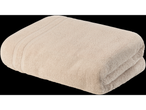 Folded beige bath towel.