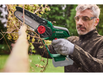 A man uses a Parkside® 20 V cordless shrub cutter to trim branches.