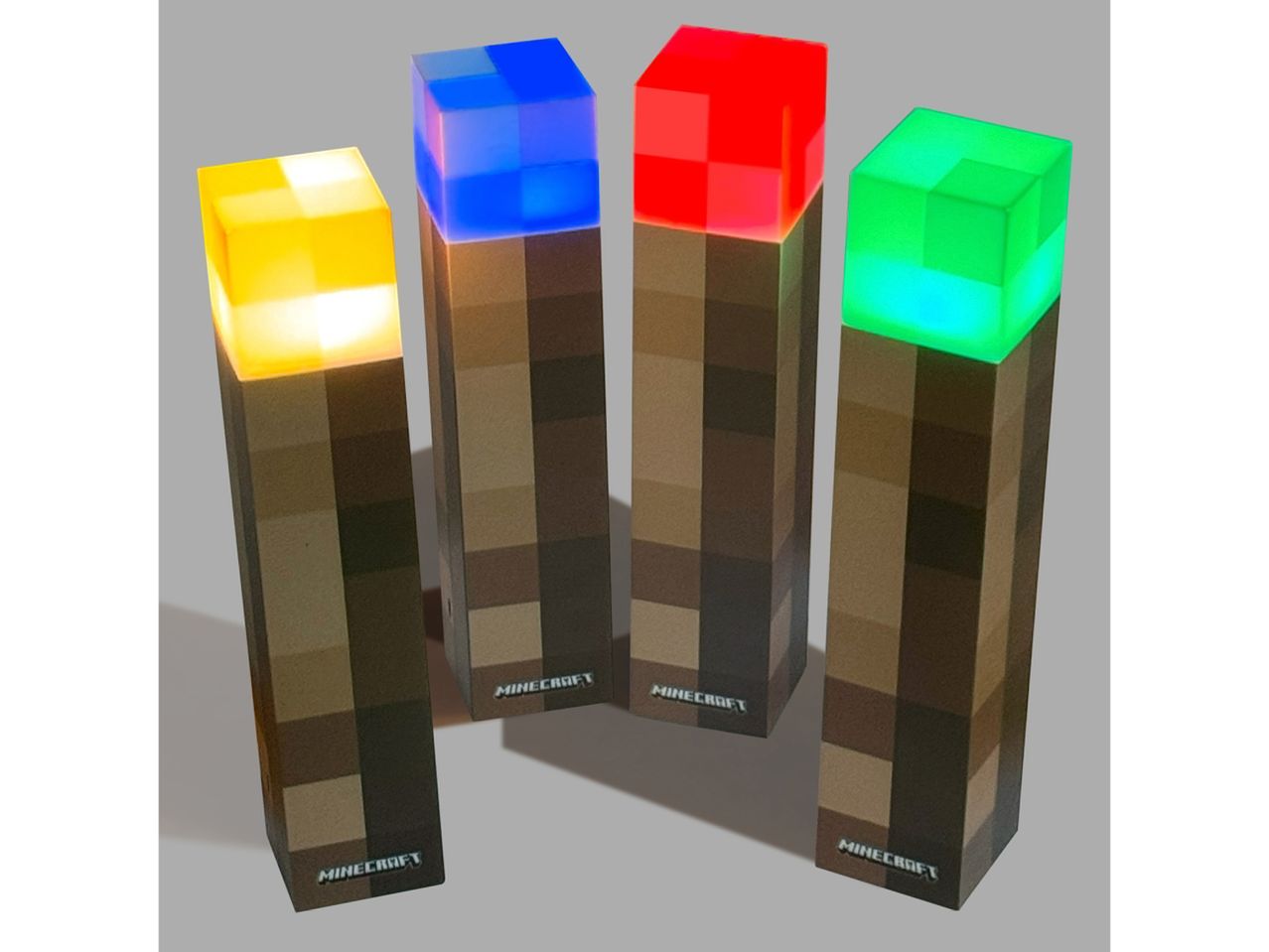 Quattro torce Minecraft a LED, colorate di giallo, blu, rosso e verde.