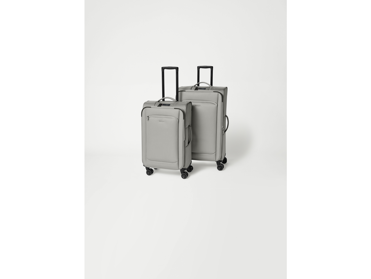 Two Esmara trolley suitcases in light grey, one larger and one smaller, standing upright.