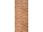 A vertical section of a wall made of light brown, irregularly shaped stone blocks.