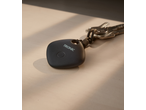 Black key finder with a button and the word 'TRONIC' on it, attached to a set of keys.