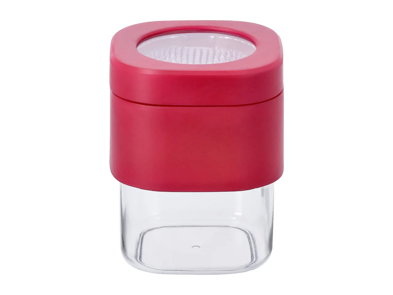 Red and clear square spice grinder with a textured grinding mechanism.