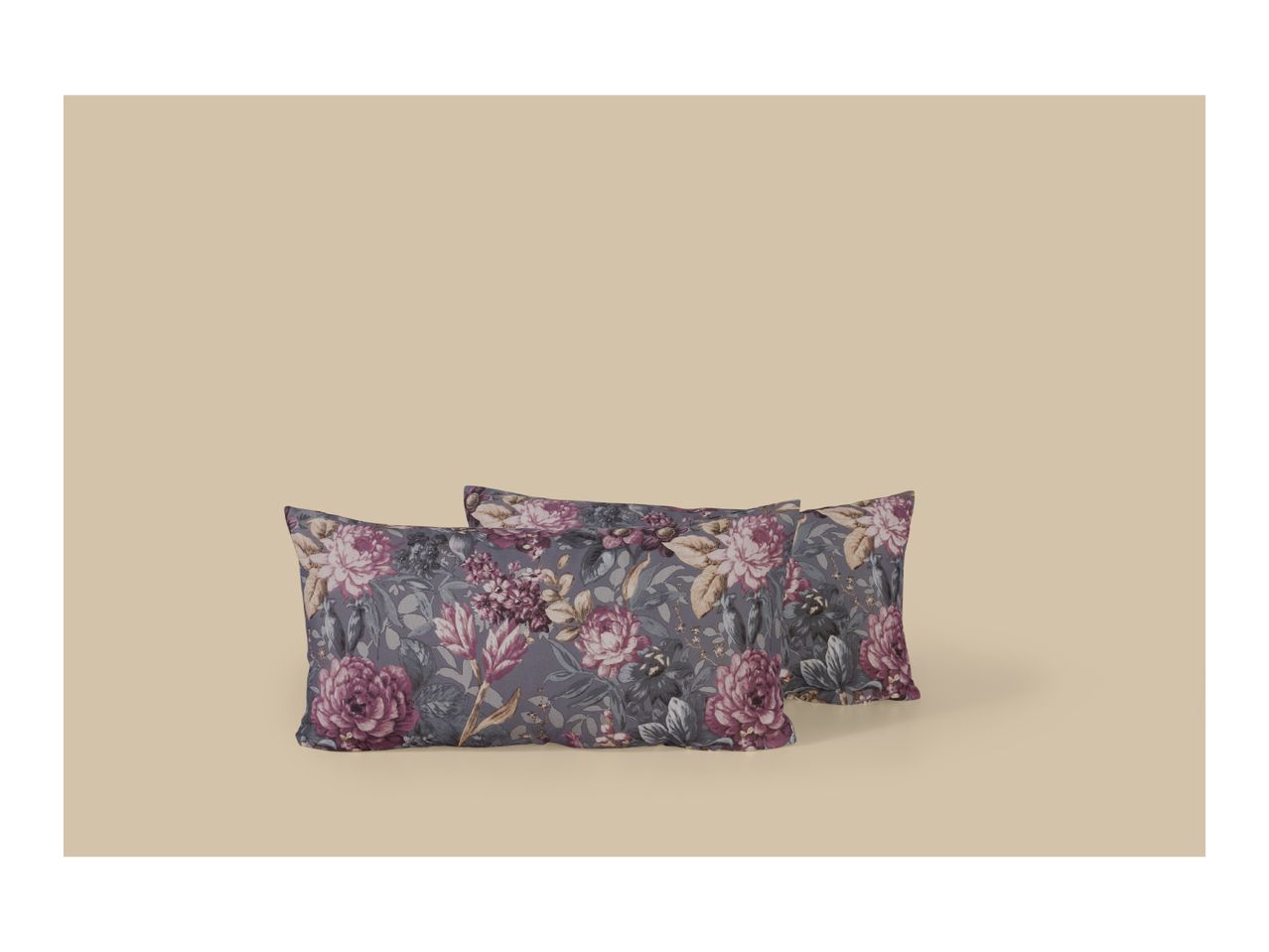 Two floral pillows with purple and pink flowers on a grey background.