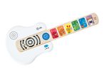 White toy guitar with a wooden neck featuring colorful animal characters and musical notes.