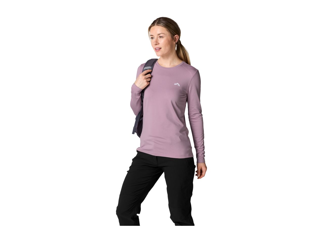 A woman wearing a purple long-sleeved functional shirt and black outdoor trousers.