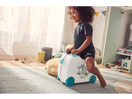 Smiling child riding a white suitcase with jungle animals and '60 bananas!' text.